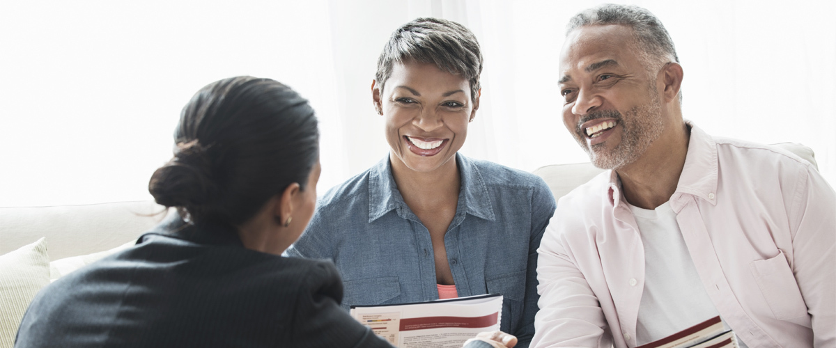 Couple meeting with a sales agent.