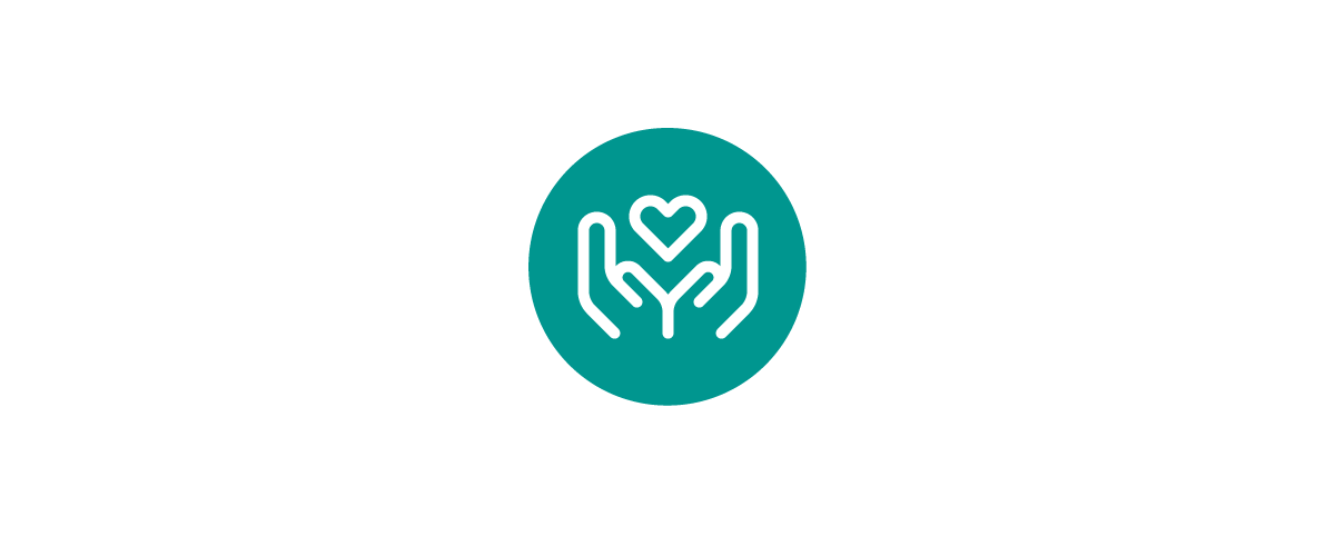 Teal circular icon showing two open hands holding a heart, symbolizing care, compassion, support, and a commitment to health, wellness, and community well-being.