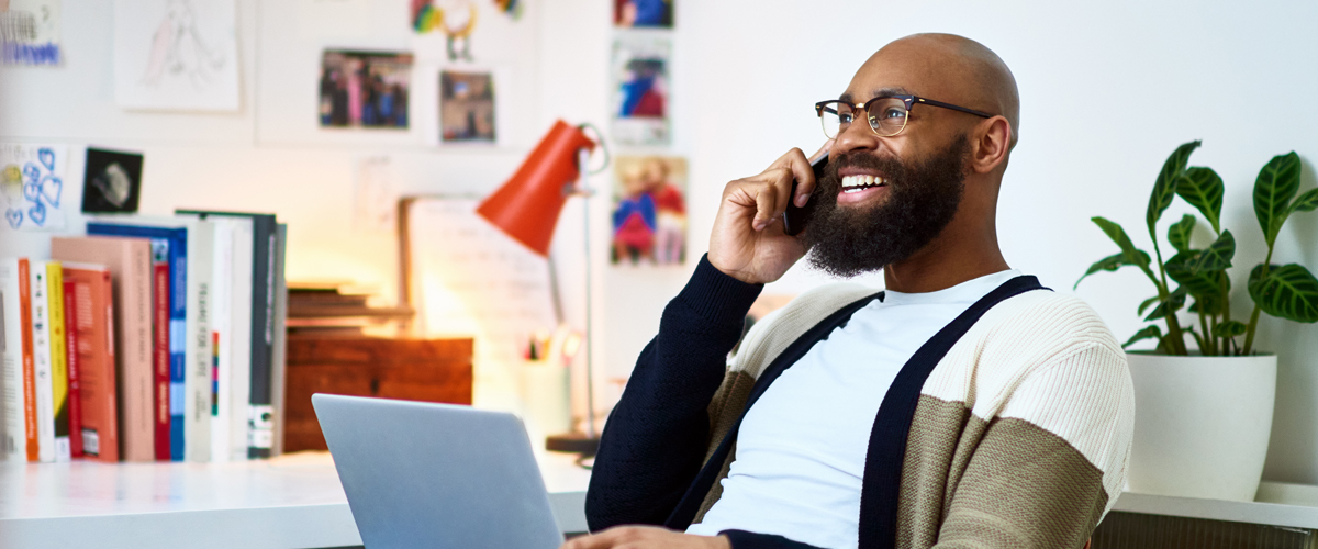 Man talking on the phone in an office.