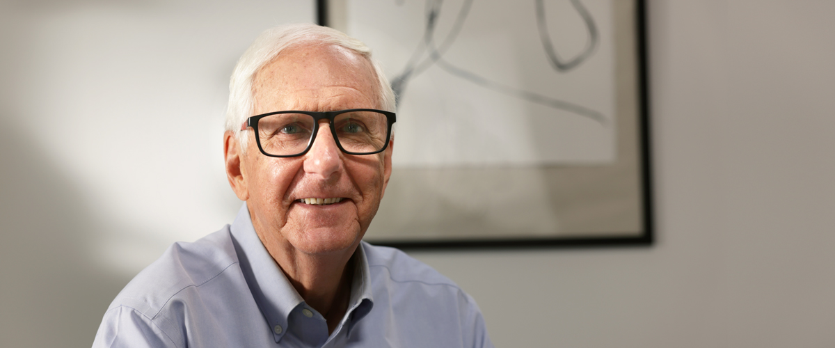 Senior man wearing glasses smiling