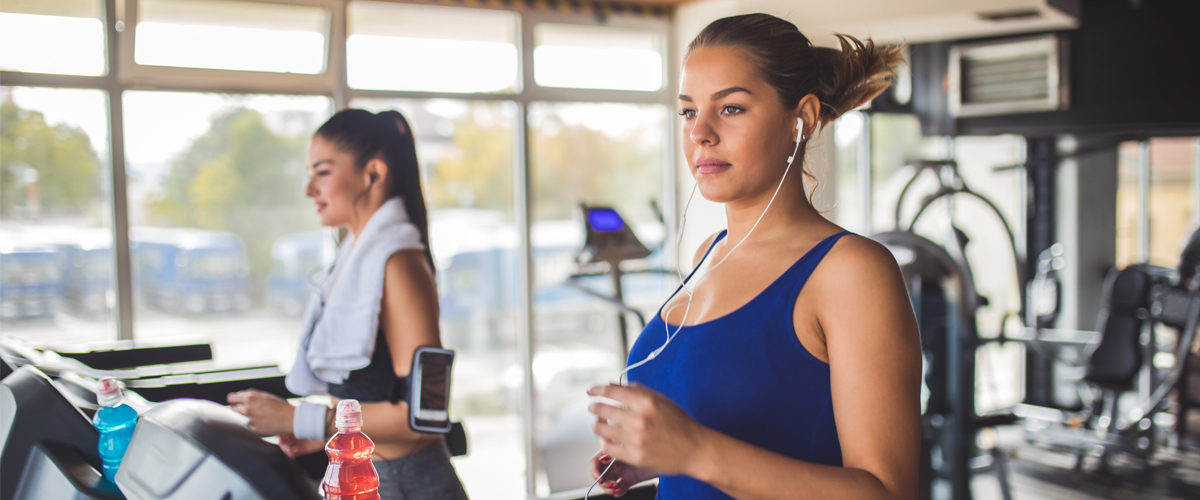 Woman exercising on a treadmill at the gym,