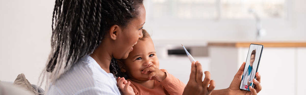 Mom and baby looking at phone