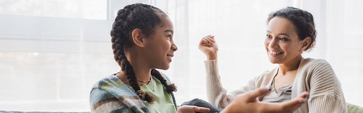 woman and girl talking