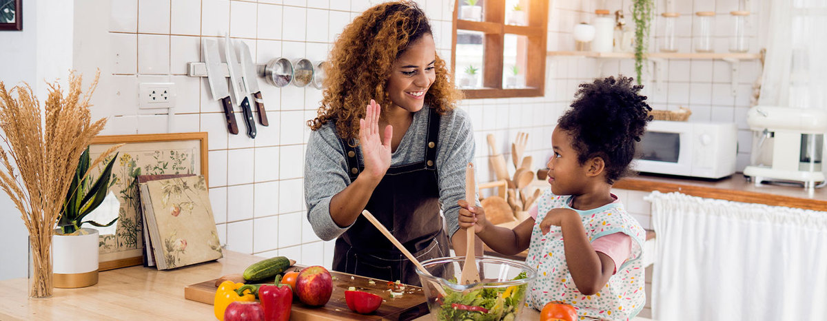 Photo of mom and daughter cooking