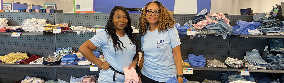 Two Medical Mutual employees posing during a volunteer shift in the community.
